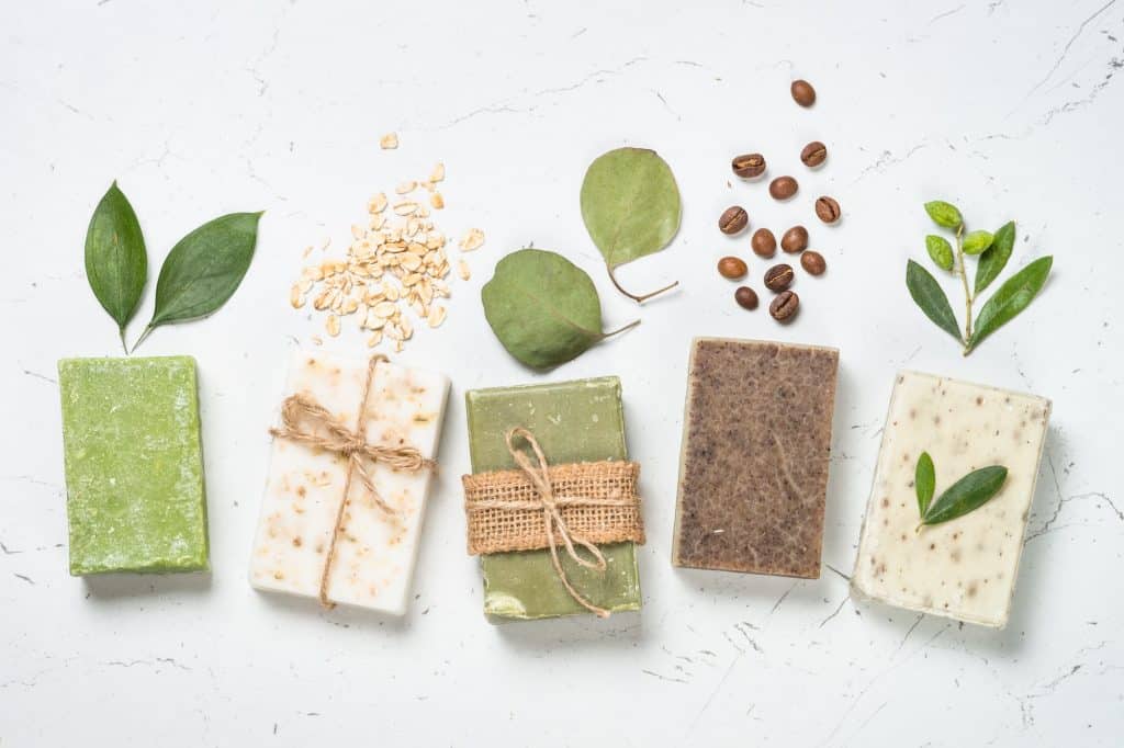 Natural soap bars on white top view